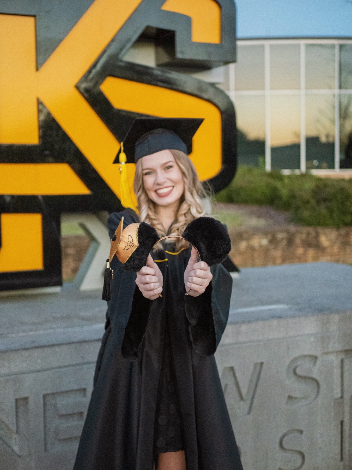 The Graduate. Faux fur, satin bow, graduation cap.